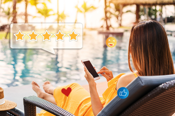 Woman sitting at a pool with a mobile phone